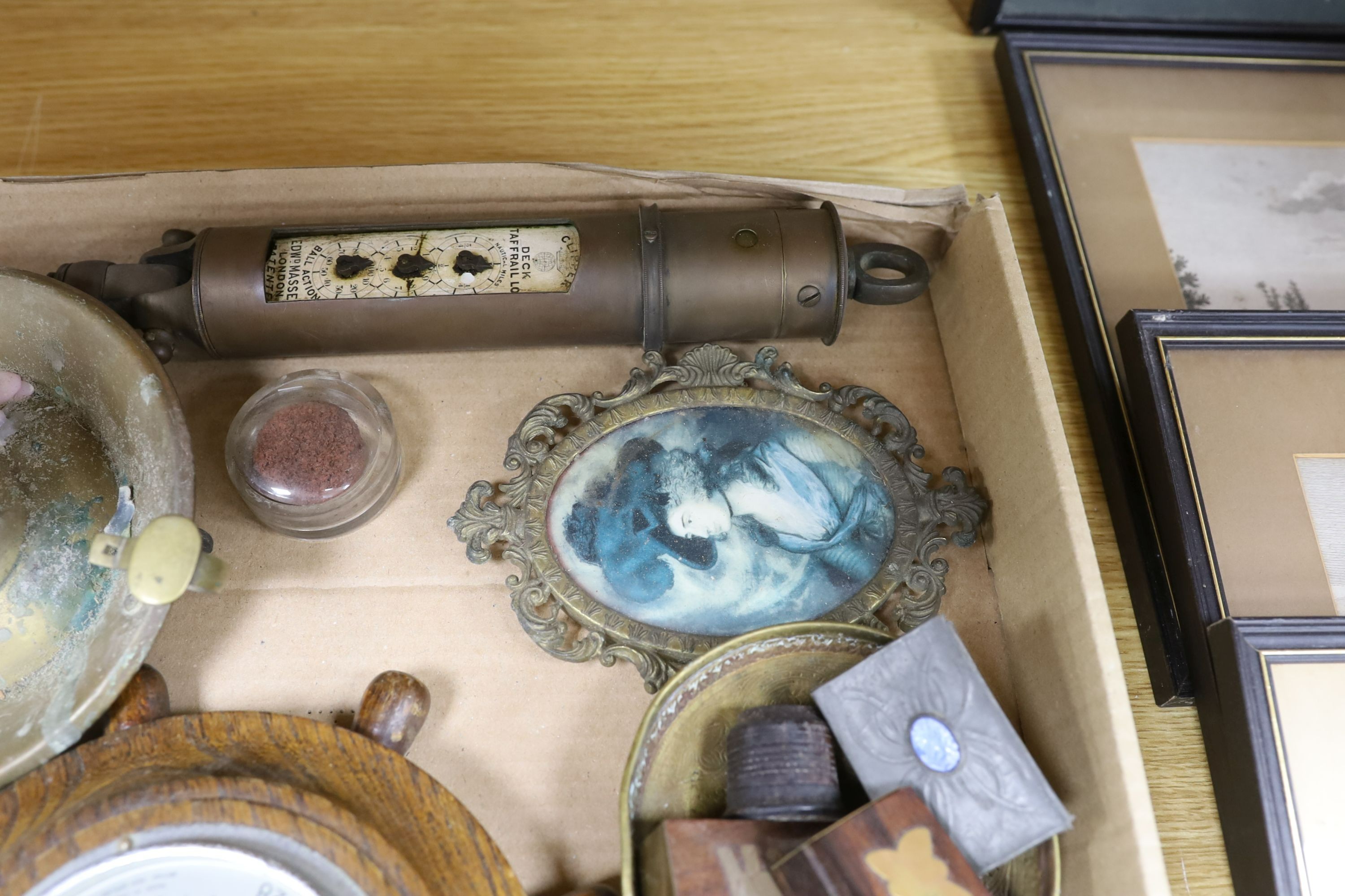 A box of curios including ship's log, brass projectile arrow and postal scales